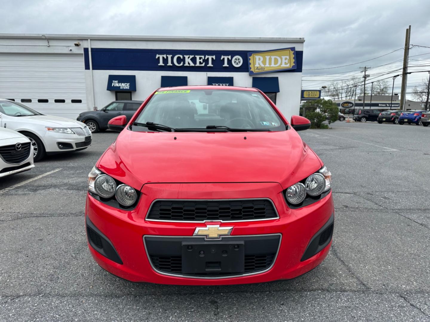 2015 RED Chevrolet Sonic LT Auto Sedan (1G1JC5SH6F4) with an 1.8L L4 DOHC 24V engine, 6-Speed Automatic transmission, located at 1254 Manheim Pike, Lancaster, PA, 17601, (717) 393-9133, 40.062870, -76.323273 - Photo#1